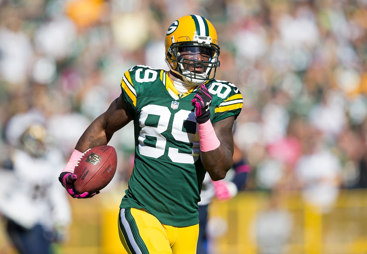 Green Bay Packers wide receiver James Jones (89) catches what turns out to be a 65-yard catch and run for a touchdown during an NFL game against the St. Louis Rams on Sunday, Oct. 11, 2015, in Green Bay, Wisc. The Packers won the game, 24-10. (Greg Trott via AP)