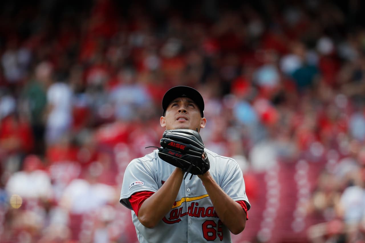 St. Louis Cardinals relief pitcher Giovanny Gallegos reacts after striking out Cincinnati Reds' Scooter Gennett for the final out on a bases-loaded fifth inning of a baseball game, Sunday, July 21, 2019, in Cincinnati. (AP Photo/John Minchillo)