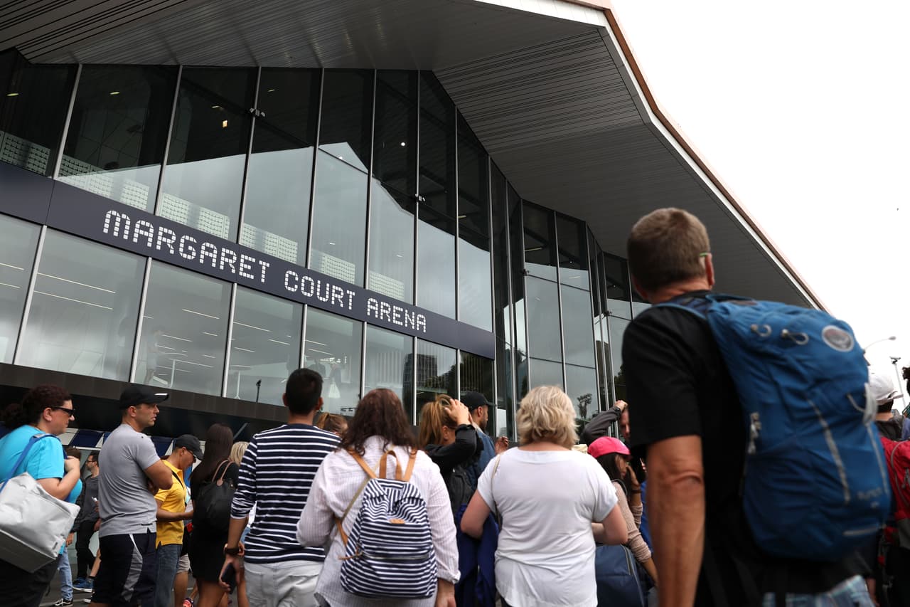 MELBOURNE, AUSTRALIA - JANUARY 15: Spectators arrive at Margaret Court Arena for day one of the 2018 Australian Open at Melbourne Park on January 15, 2018 in Melbourne, Australia. (Photo by Mark Kolbe/Getty Images)