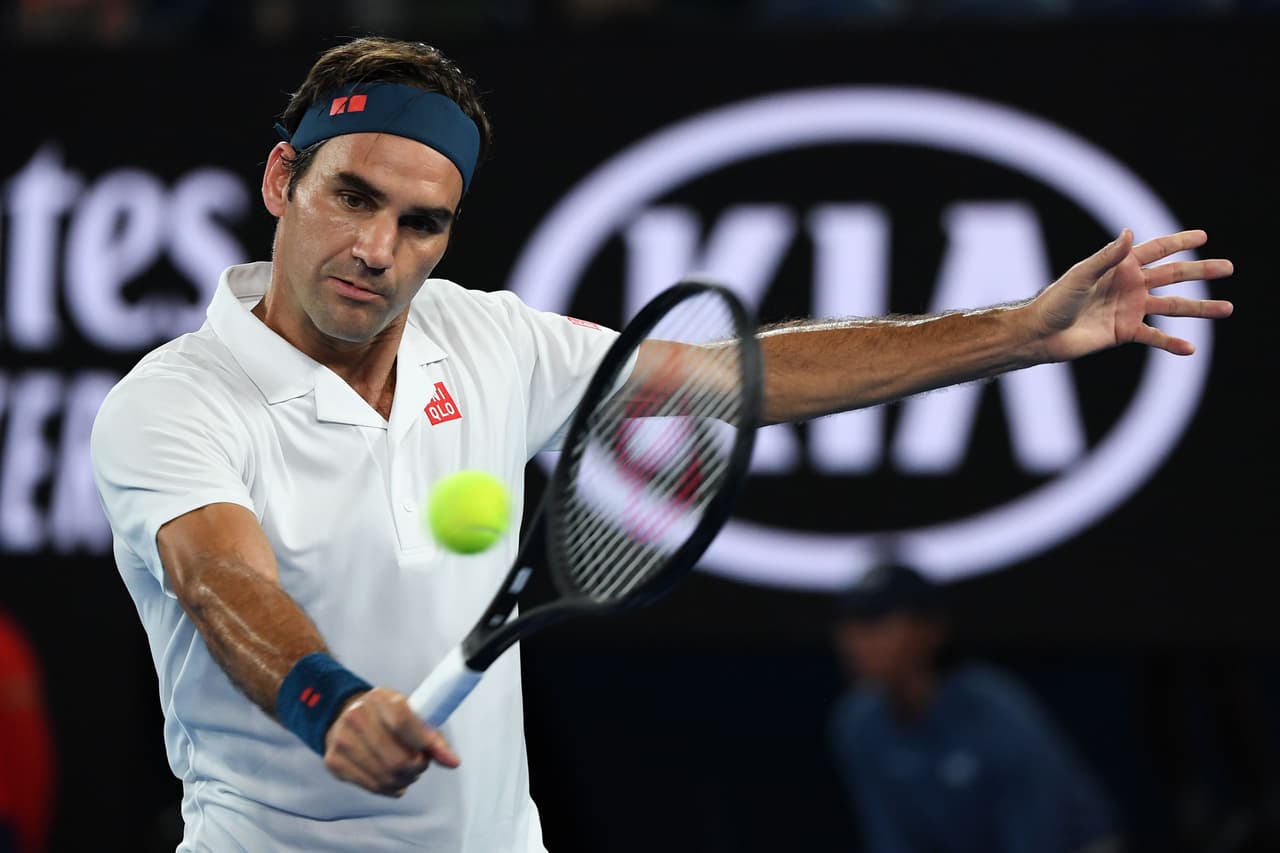 Switzerland's Roger Federer hits a return against Taylor Fritz of the US during their men's singles match on day five of the Australian Open tennis tournament in Melbourne on January 18, 2019. (Photo by WILLIAM WEST / AFP) / -- IMAGE RESTRICTED TO EDITORIAL USE - STRICTLY NO COMMERCIAL USE -- (Photo credit should read WILLIAM WEST/AFP/Getty Images)