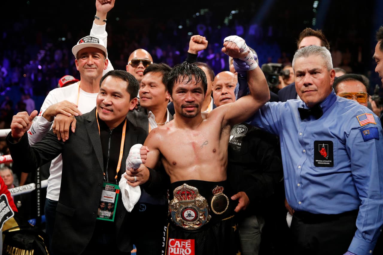 Manny Pacquiao celebrates his win against Adrien Broner in the WBA welterweight title boxing match Saturday, Jan. 19, 2019, in Las Vegas. (AP Photo/John Locher)