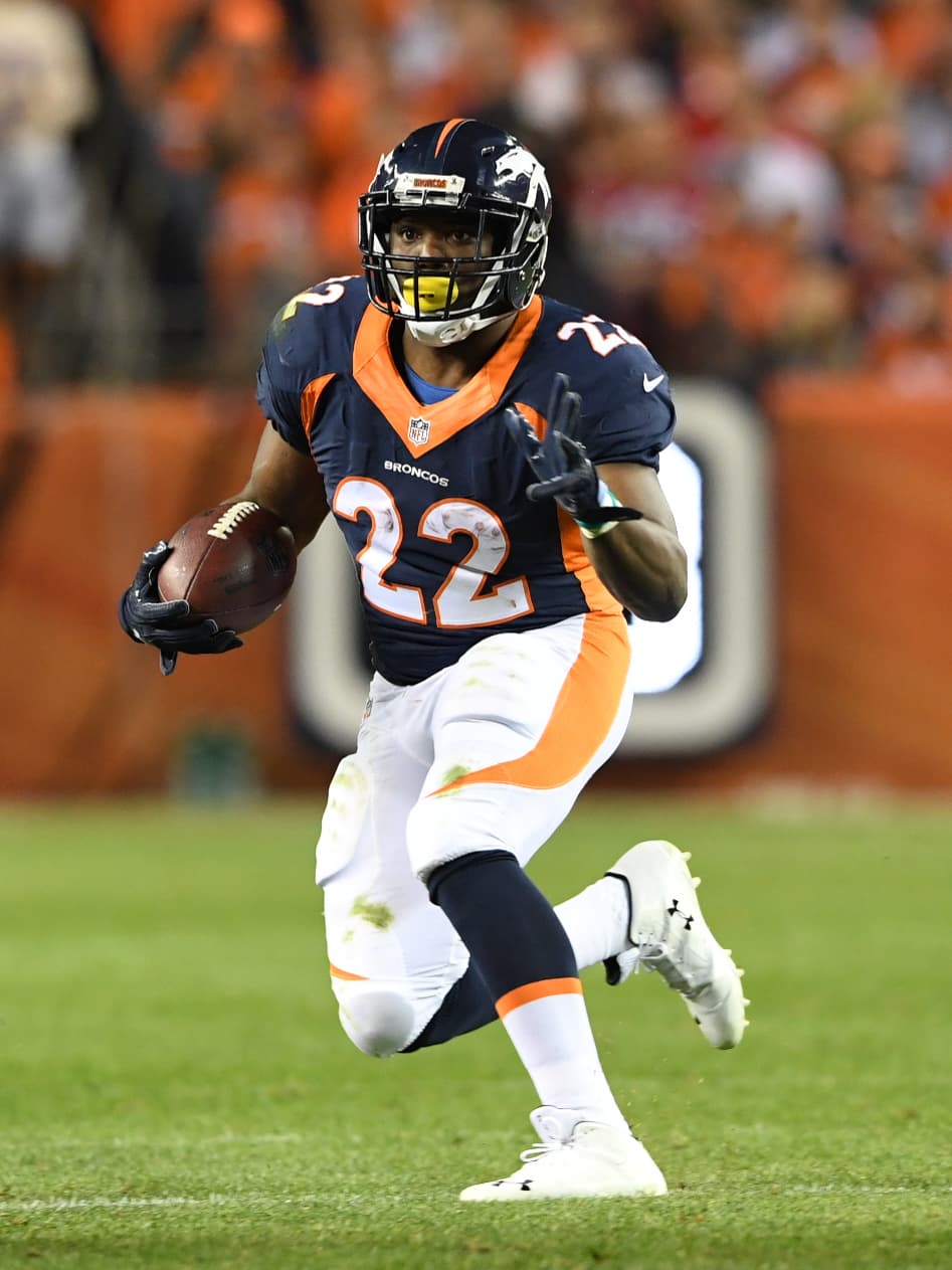 Denver Broncos running back C.J. Anderson (22) scampers for 6 yards during fourth quarter action against the Houston Texans in the NFL game at Sports Authority Field in Denver, Colo. October 24, 2016. (Eric Bakke via AP)