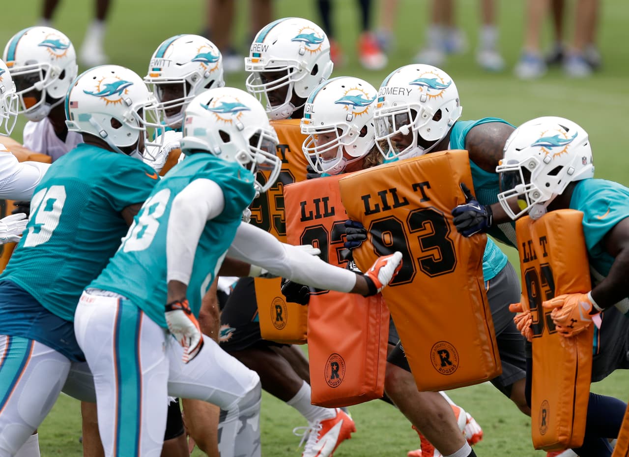 Miami Dolphins players participate in an NFL football organized team activity, Tuesday, May 26, 2015, at the Dolphins training facility in Davie, Fla. (AP Photo/Wilfredo Lee)