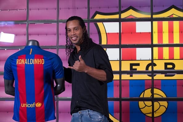 Brazilian football star Ronaldinho poses during his official presentation as new FC Barcelona ambassador at the Camp Nou stadium in Barcelona on February 3, 2017. / AFP / Josep Lago (Photo credit should read JOSEP LAGO/AFP/Getty Images)