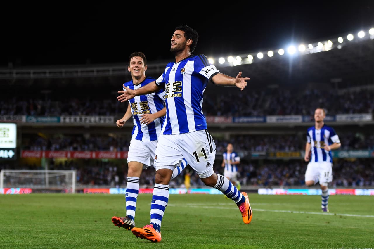 SAN SEBASTIAN, SPAIN - AUGUST 31: Carlos Vela Garrido of Real Sociedad celebrates after scoring his team's fourth goal during the La Liga match between Real Sociedad de Futbol and Real Madrid CF at Estadio Anoeta on August 31, 2014 in San Sebastian, Spain. (Photo by David Ramos/Getty Images)
