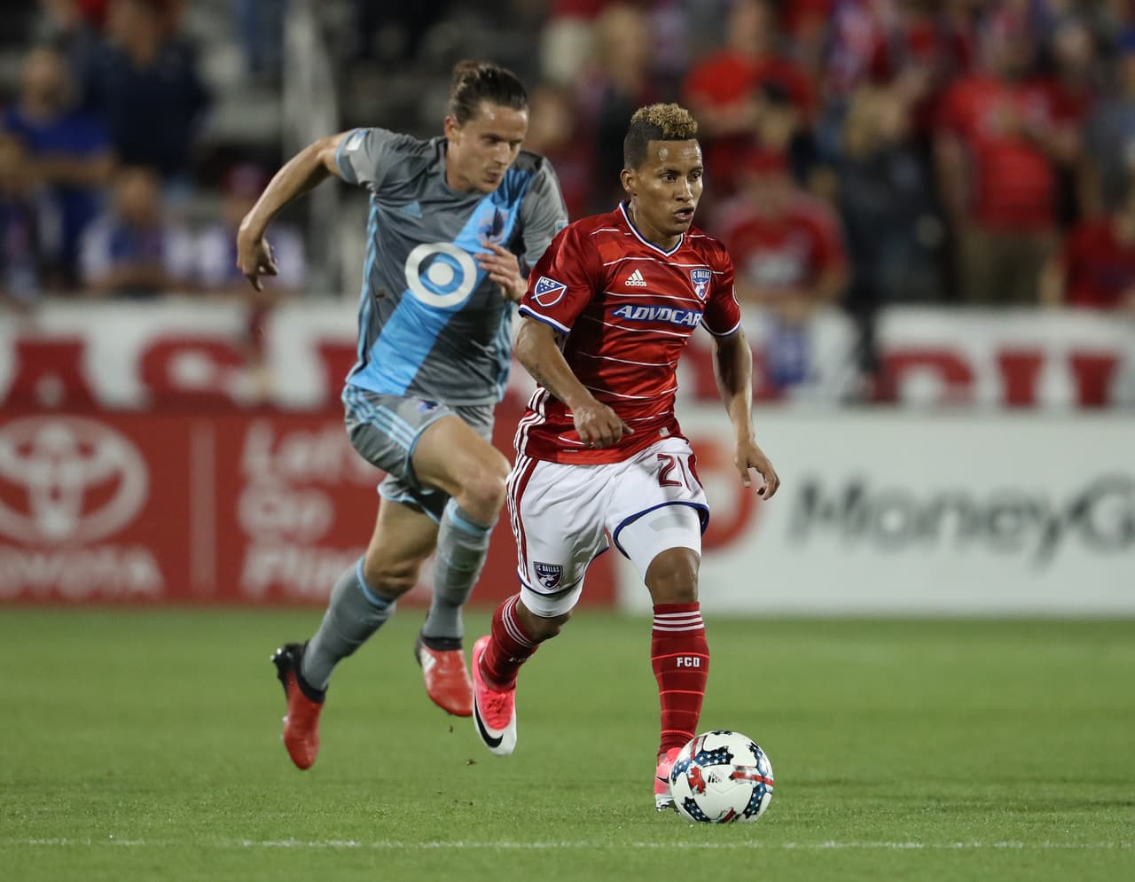 Apr 8, 2017; Dallas, TX, USA; FC Dallas midfielder Michael Barrios (21) controls the ball against Minnesota United FC midfielder Marc Burch (8) at Toyota Stadium. Dallas beat Minnesota 2-0. Mandatory Credit: Matthew Emmons-USA TODAY Sports