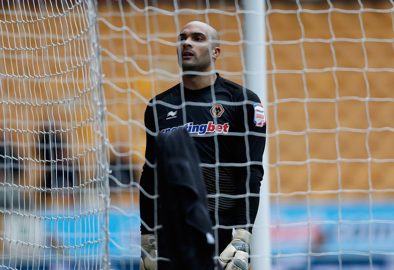 WOLVERHAMPTON, ENGLAND - MARCH 16: Wolves goalkeeper Carl Ikeme stands dejectedly in the goal after conceding the first goal during the npower Championship match between Wolverhampton Wanderers and Bristol City at Molineux on March 16, 2013 in Wolverhampton, England. (Photo by Harry Engels/Getty Images)