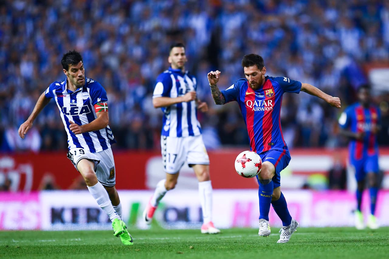MADRID, SPAIN - MAY 27: Lionel Messi of FC Barcelona competes for the ball with Manu Garcia of Deportivo Alaves during the Copa Del Rey Final between FC Barcelona and Deportivo Alaves at Vicente Calderon stadium on May 27, 2017 in Madrid, Spain. (Photo by David Ramos/Getty Images)