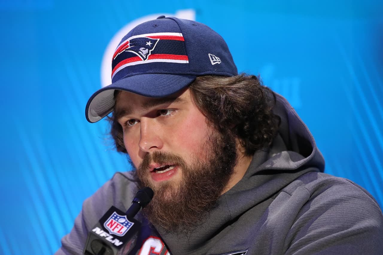 ATLANTA, GEORGIA - JANUARY 28: Center David Andrews #60 of the New England Patriots talks to the media during Super Bowl LIII Opening Night at State Farm Arena on January 28, 2019 in Atlanta, Georgia. (Photo by Rob Carr/Getty Images)