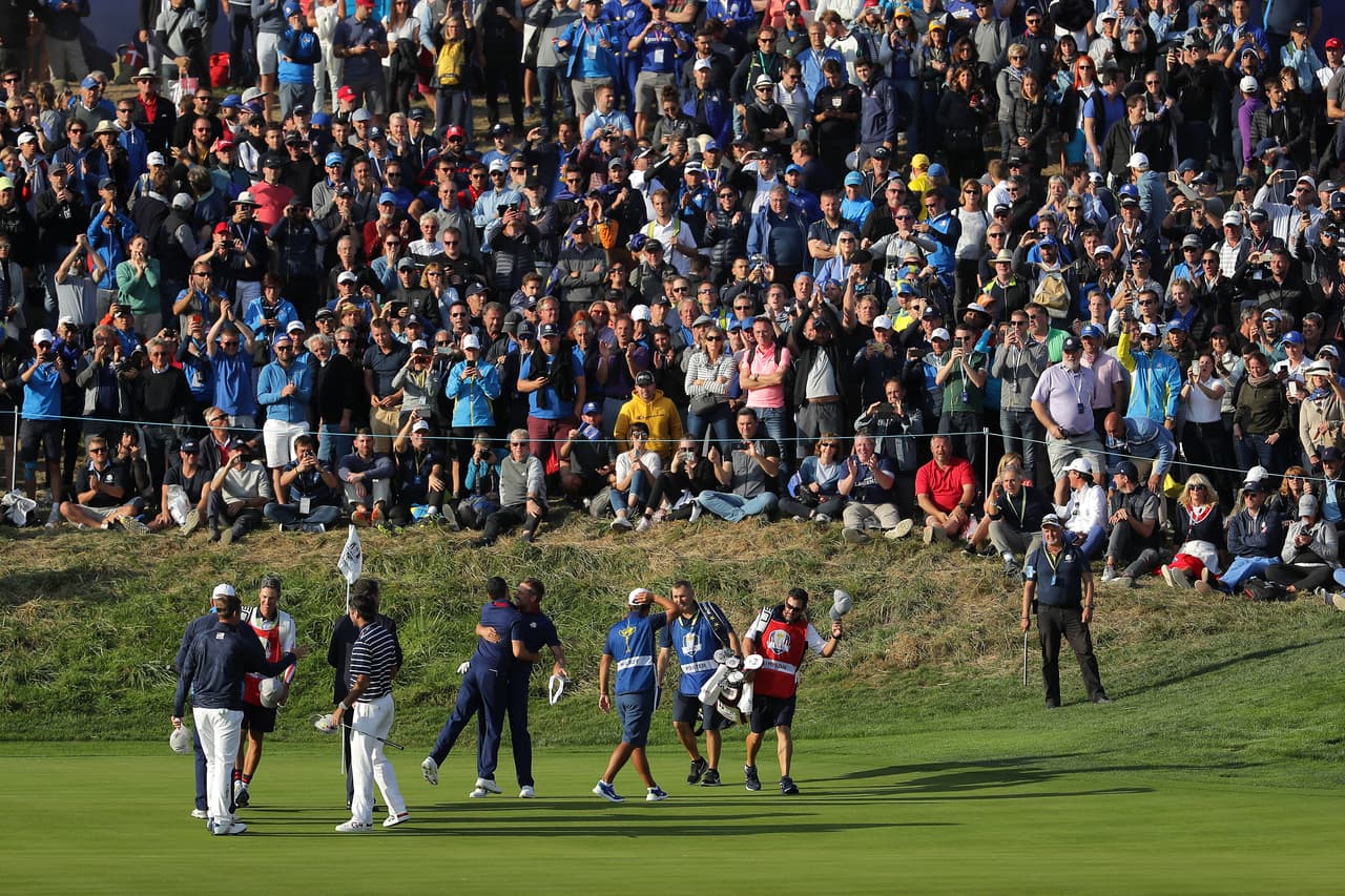 PARIS, FRANCE - SEPTEMBER 28: Rory McIlroy and Ian Poulter celebrate their 4&2 victory over Bubba Watson and Webb Simpson during the afternoon foursome matches of the 2018 Ryder Cup at Le Golf National on September 28, 2018 in Paris, France. (Photo by Richard Heathcote/Getty Images)