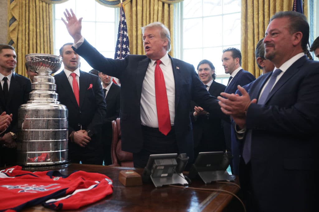WASHINGTON, DC - MARCH 25: U.S. President Donald Trump waves as left wing and MVP Alexander Ovechkin of the Washington Capitals and other team members look on during an Oval Office event at the White House March 25, 2019 in Washington, DC. President Trump hosted the Washington Capitals to honor their 2018 Stanley Cup championship. (Photo by Alex Wong/Getty Images)