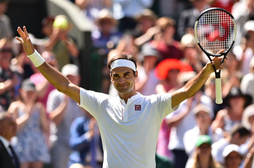 Switzerland's Roger Federer celebrates after beating Serbia's Dusan Lajovic 6-1, 6-3, 6-4 in their men's singles first round match on the first day of the 2018 Wimbledon Championships at The All England Lawn Tennis Club in Wimbledon, southwest London, on July 2, 2018. (Photo by Glyn KIRK / AFP) / RESTRICTED TO EDITORIAL USE (Photo credit should read GLYN KIRK/AFP/Getty Images)
