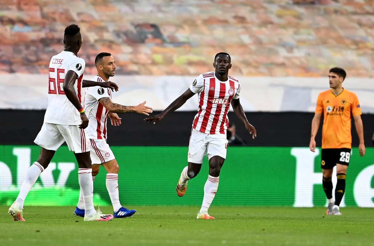 WOLVERHAMPTON, ENGLAND - AUGUST 06: Mady Camara of Olympiacos celebrates after he scores his sides first goal which is later disallowed for offside following a VAR check during the UEFA Europa League round of 16 second leg match between Wolverhampton Wanderers and Olympiacos FC at Molineux on August 06, 2020 in Wolverhampton, England. (Photo by Laurence Griffiths/Getty Images)