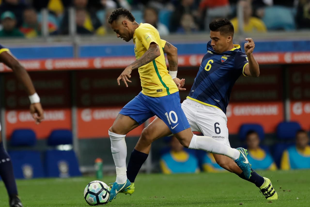 CORRECTS NAME OF ECUADOR PLAYER - Brazil's Neymar, left, runs with the ball past Ecuador's Christian Noboa, right, during a 2018 World Cup qualifying soccer match in Porto Alegre, Brazil, Thursday, Aug. 31, 2017. (AP Photo/Andre Penner)