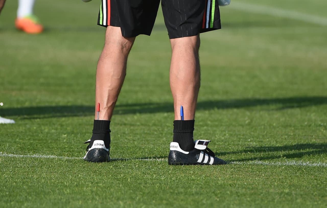 Methodically, he takes notes in blue and red ink to work out his choices.