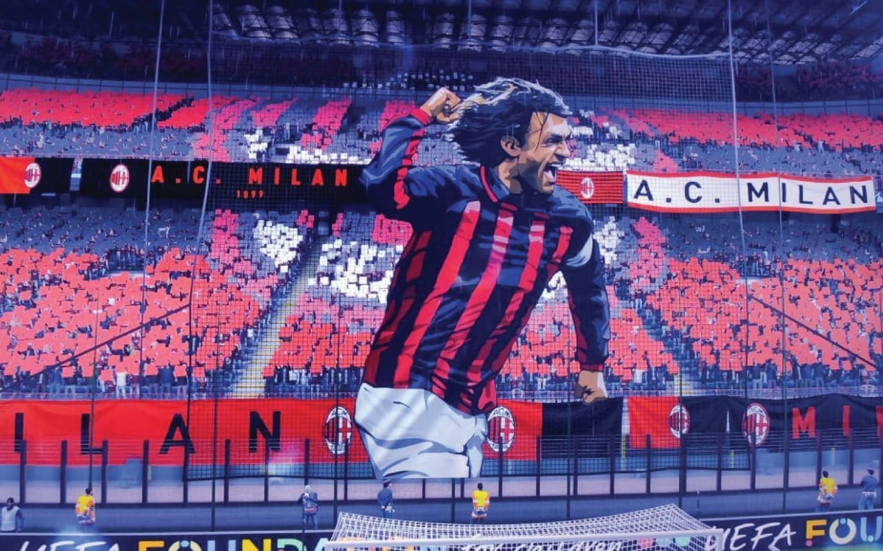 El hijo pródigo, Paolo Maldini, leyenda del Milan empuja con fuerza desde las gradas a través de un tifo.