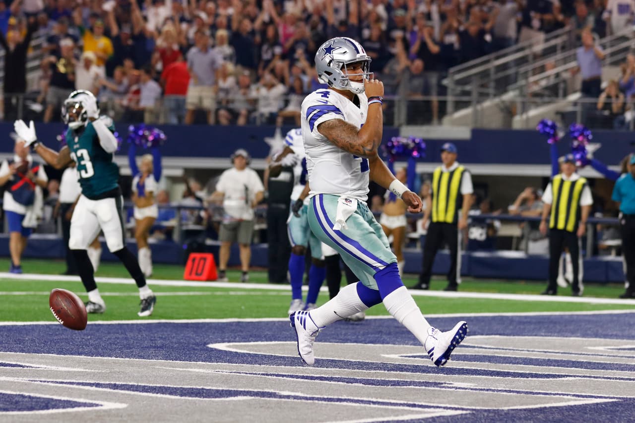 Dallas Cowboys quarterback Dak Prescott (4) scores a touchdown during an NFL football game against the Philadelphia Eagles, Sunday, Oct. 30, 2016, in Arlington, Texas. The Cowboys defeated the Eagles in overtime, 29-23. (Ryan Kang via AP)