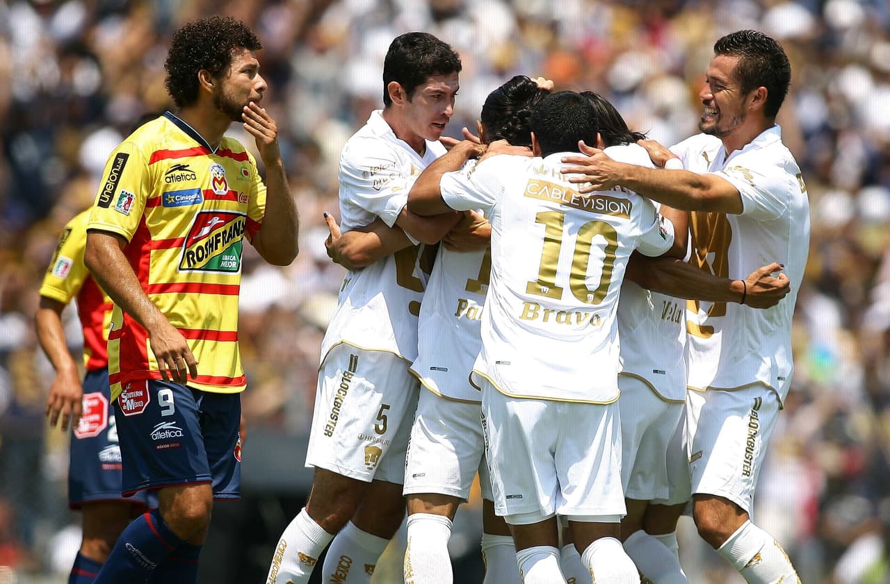 El Estadio Morelos fue el escenario para el primer cotejo de la serie. Ante poco más de 42 mil espectadores, ‘El Gatillero’ Palencia abrió el marcador al 68’ poniendo al frente a los Pumas.