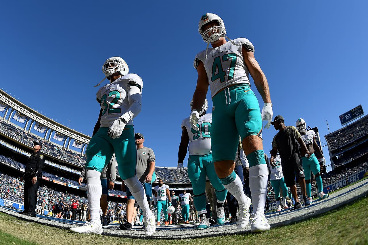 SAN DIEGO - NOVEMBER 13: Kenyan Drake #32 and Kiko Alonso #47 of the Miami Dolphins walk on the field for a game against the San Diego Chargers at Qualcomm Stadium on November 13, 2016 in San Diego, California. (Photo by Donald Miralle/Getty Images)