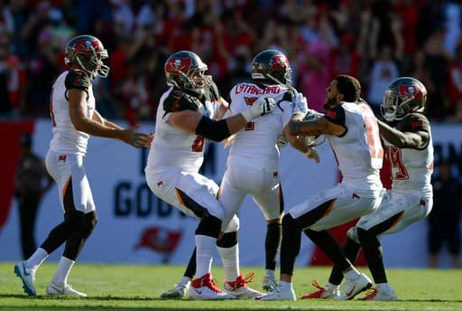 Tampa Bay Buccaneers kicker Chandler Catanzaro (7) celebrates with teammates after his game-winning 59-yard field goal in overtime of an NFL football game Sunday, Oct. 21, 2018, in Tampa, Fla. (AP Photo/Jason Behnken)