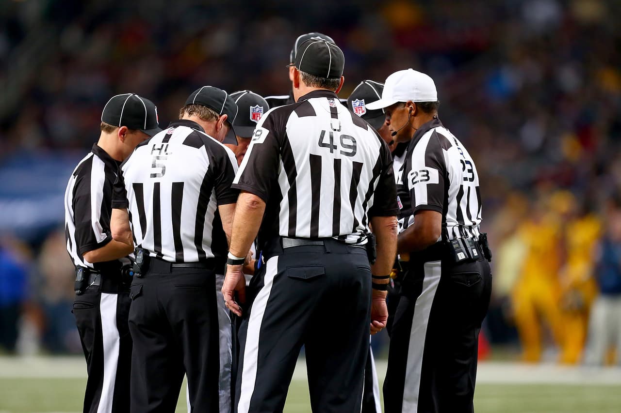 ST. LOUIS, MO - DECEMBER 17: Referees discuss a call in the second quarter of a game between the St. Louis Rams and the Tampa Bay Buccaneers at the Edward Jones Dome on December 17, 2015 in St. Louis, Missouri. (Photo by Dilip Vishwanat/Getty Images)