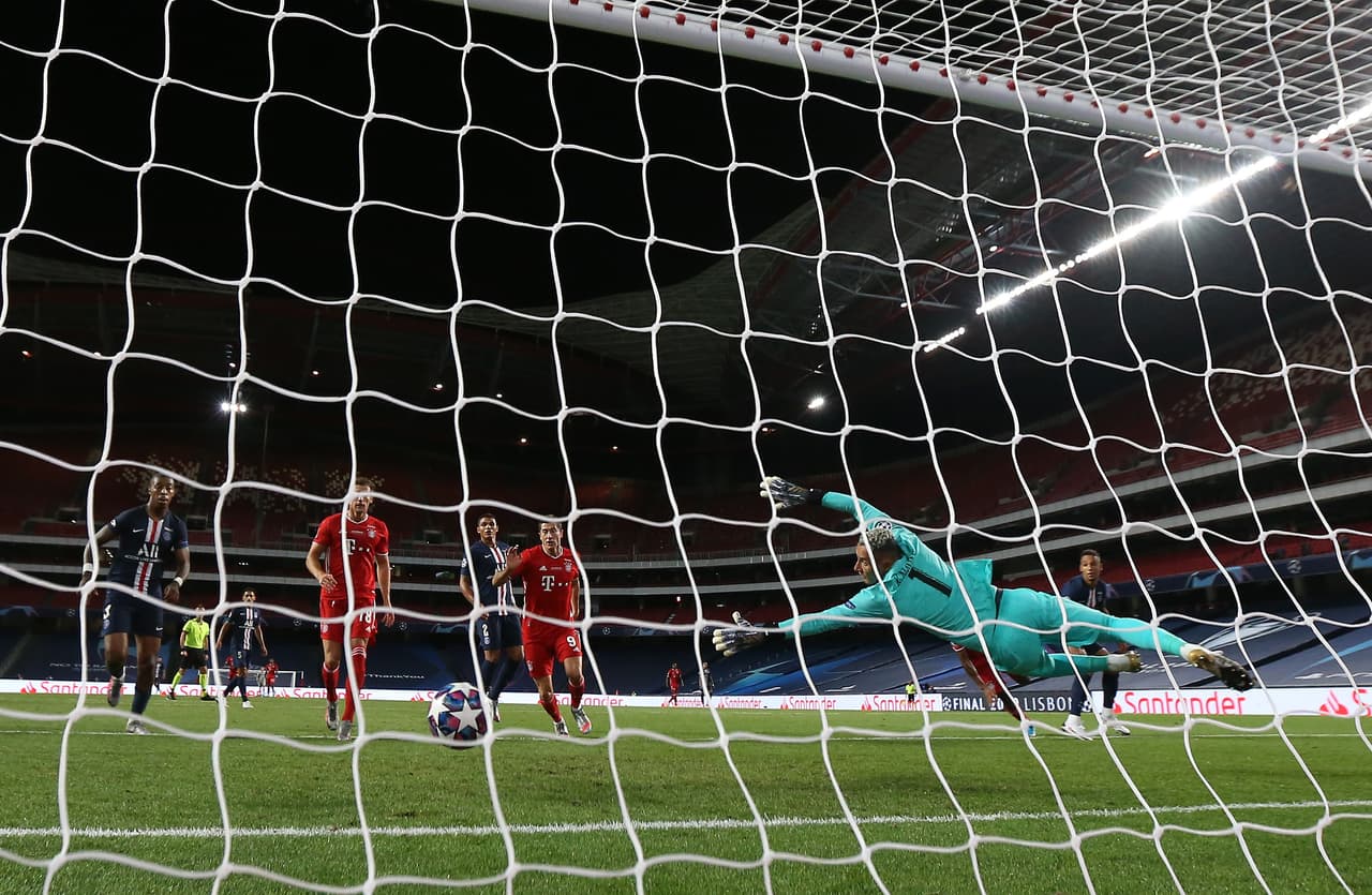 LISBON, PORTUGAL - AUGUST 23: Kingsley Coman of FC Bayern Munich (hidden) scores his team's first goal past goalkeeper Keylor Navas during the UEFA Champions League Final match between Paris Saint-Germain and Bayern Munich at Estadio do Sport Lisboa e Benfica on August 23, 2020 in Lisbon, Portugal. (Photo by Miguel A. Lopes/Pool via Getty Images)