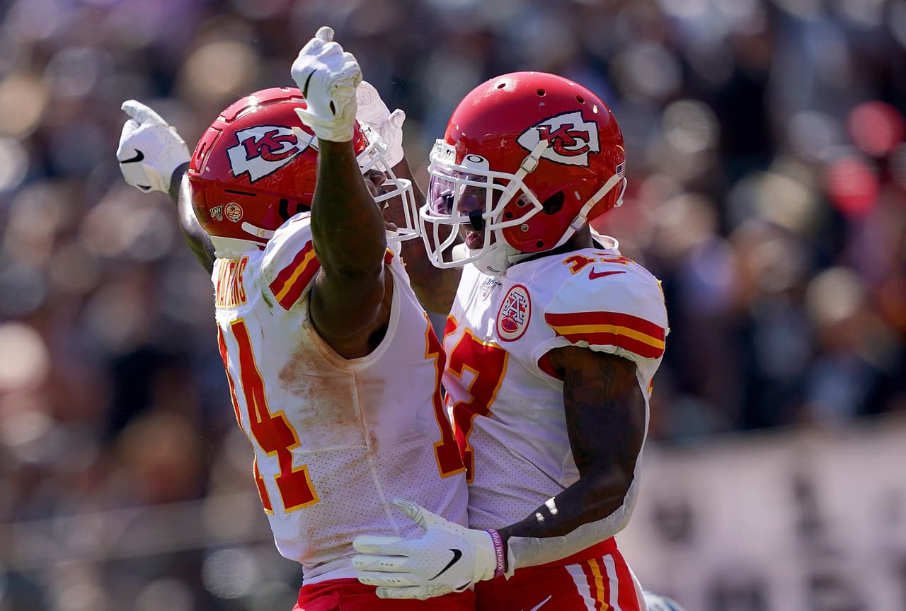 OAKLAND, CA - SEPTEMBER 15: Mecole Hardman #17 and Sammy Watkins #14 of the Kansas City Chiefs celebrates after Hardman caught a touchdown pass against the Oakland Raiders during the second quarter of an NFL football game at RingCentral Coliseum on September 15, 2019 in Oakland, California. (Photo by Thearon W. Henderson/Getty Images)