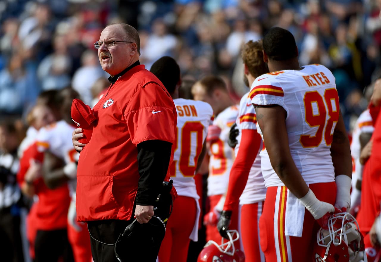 SAN DIEGO, CA - JANUARY 01: Head coach Andy Reid of the Kansas City Chiefs and players react during the national anthem ahead of a game against the San Diego Chargers at Qualcomm Stadium on January 1, 2017 in San Diego, California. (Photo by Donald Miralle/Getty Images)