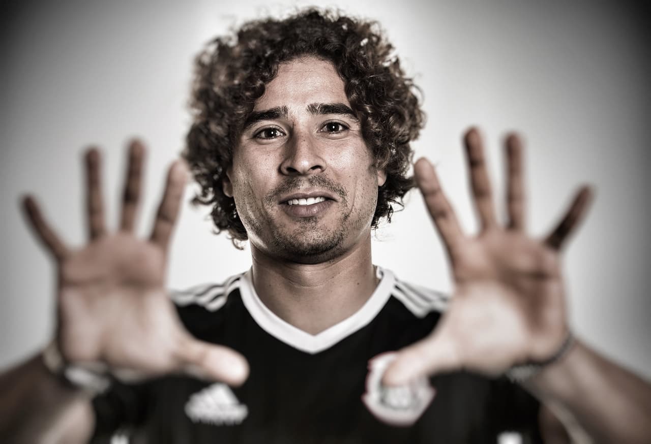 KAZAN, RUSSIA - JUNE 14: (EDITOR'S NOTE: Image was processed using digital filters.) Guillermo Ochoa poses for a picture during the Mexico team portrait session on June 14, 2017 in Kazan, Russia. (Photo by Alex Grimm - FIFA/FIFA via Getty Images)