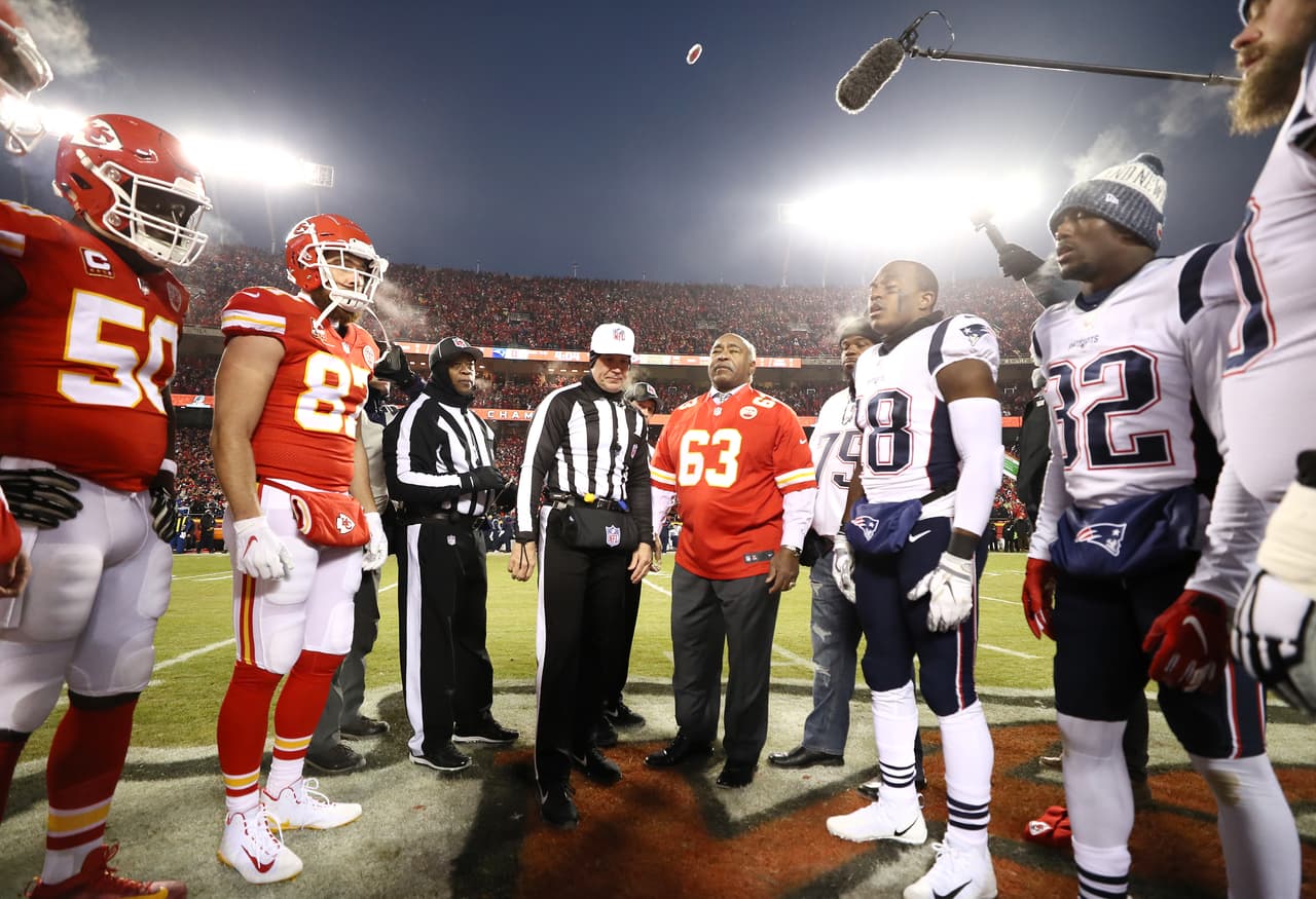 KANSAS CITY, MISSOURI - JANUARY 20: The Kansas City Chiefs and New England Patriots meet at the 50 yard line for the coin toss during the AFC Championship Game at Arrowhead Stadium on January 20, 2019 in Kansas City, Missouri. (Photo by Jamie Squire/Getty Images)