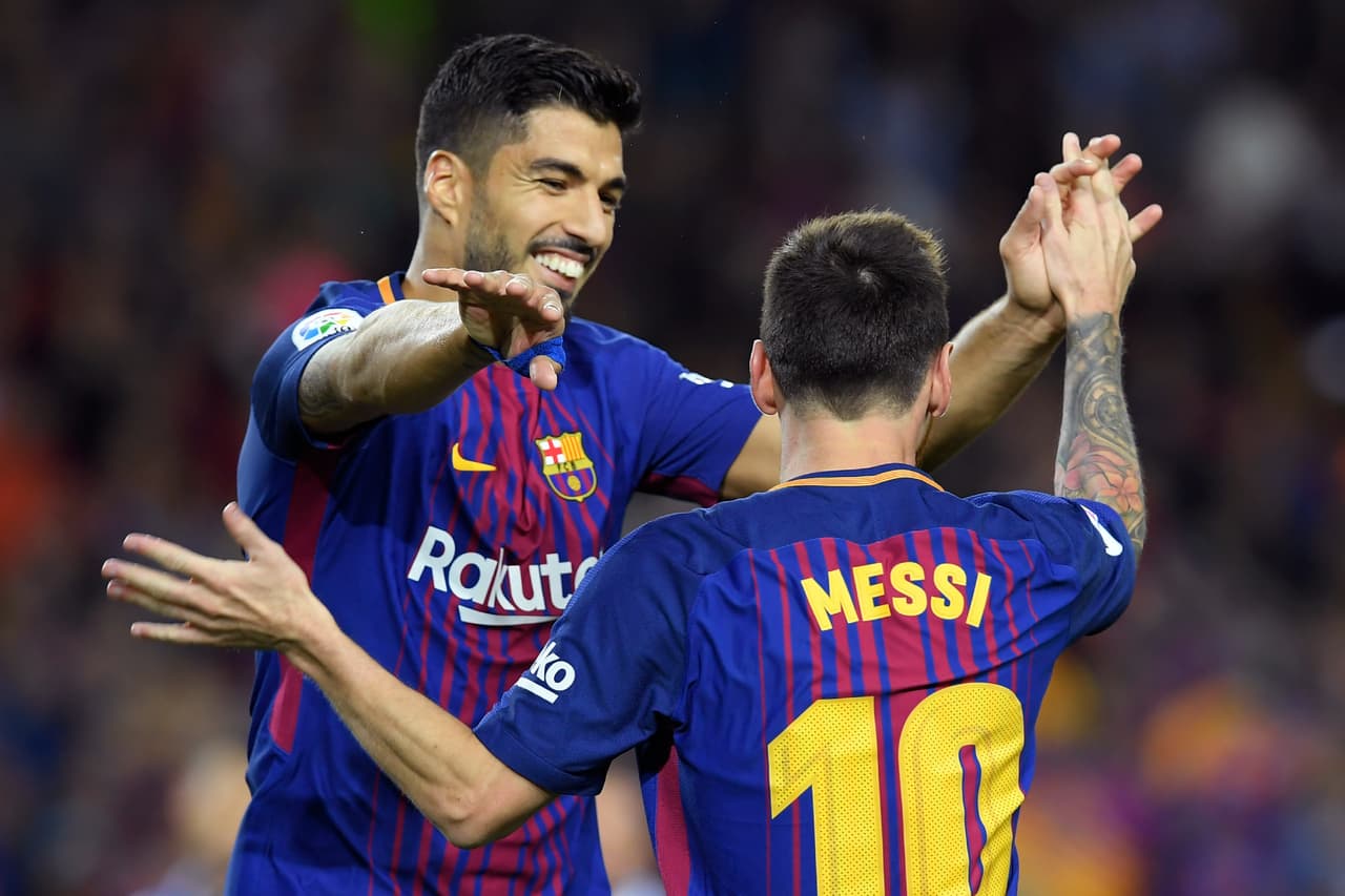 Barcelona's Argentinian forward Lionel Messi (R) celebrates with Barcelona's Uruguayan forward Luis Suarez after scoring during the Spanish Liga football match Barcelona vs Espanyol at the Camp Nou stadium in Barcelona on September 9, 2017. / AFP PHOTO / LLUIS GENE (Photo credit should read LLUIS GENE/AFP/Getty Images)