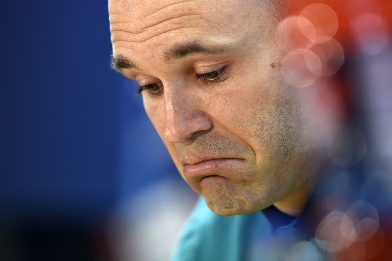 Barcelona's midfielder Andres Iniesta listens during a press conference at the Joan Gamper Sports Center in Sant Joan Despi, near Barcelona, on April 18, 2017 on the eve of the UEFA Champions League quarter-final second leg football match FC Barcelona vs Juventus. / AFP PHOTO / LLUIS GENE (Photo credit should read LLUIS GENE/AFP/Getty Images)