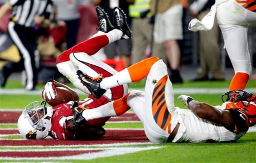 Los Cardinals salieron avantes en Domingo por la Noche al batir en el último momento a los Bengals 34-31. Acá las mejores tomas del partido.