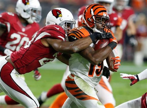 Los Cardinals salieron avantes en Domingo por la Noche al batir en el último momento a los Bengals 34-31. Acá las mejores tomas del partido.