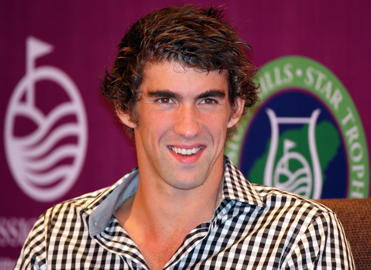 HAIKOU, CHINA - OCTOBER 27:Multiple Olympic gold medalist Michael Phelps of USA looks toward during the opening press conference of the Mission Hills Star Trophy on October 27, 2010 in Haikou, China. The Mission Hills Star Trophy is Asia's leading leisure liflestyle event and features Hollywood celebrities and international golf stars. (Photo by Athit Perawongmetha/Getty Images for Mission Hills)