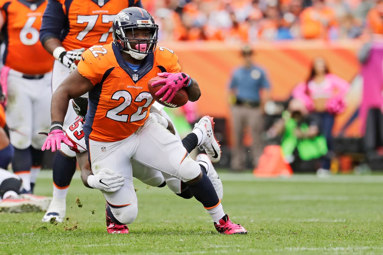 Denver Broncos running back C.J. Anderson runs against the Atlanta Falcons LaRoy Reynolds (53) during the second half of an NFL football game, Sunday, Oct. 9, 2016, in Denver. (AP Photo/Jack Dempsey)