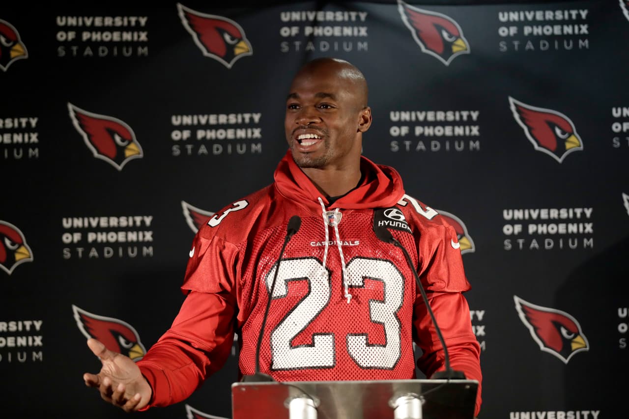 Arizona Cardinals running back Adrian Peterson speaks during a press conference before an NFL training session at the London Irish rugby team training ground in the Sunbury-onThames suburb of south west London, Wednesday, Oct. 18, 2017. The Arizona Cardinals are preparing for an NFL regular season game against the Los Angeles Rams in London on Sunday. (AP Photo/Matt Dunham)