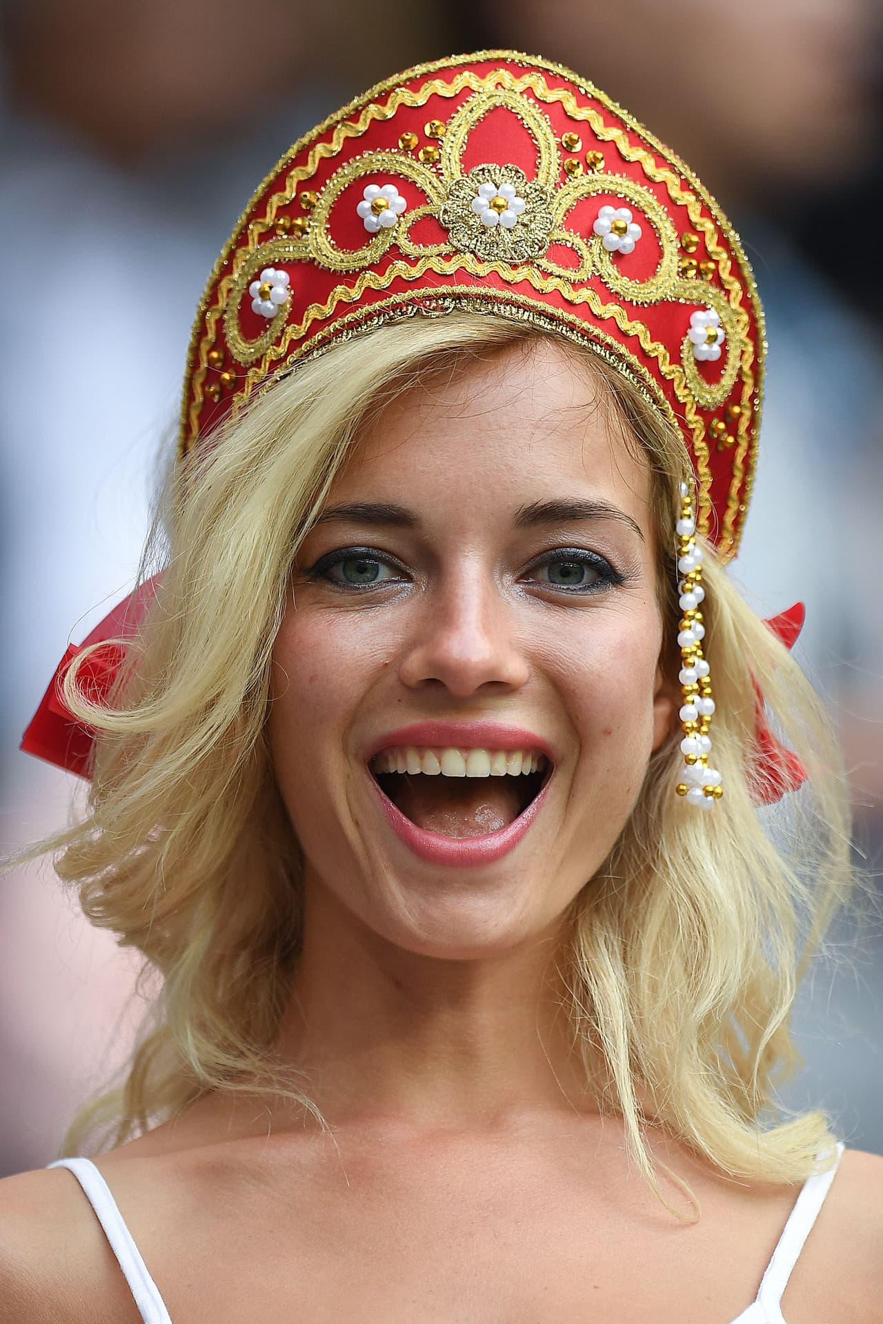 A Russia fan smiles before the start of the Russia 2018 World Cup Group A football match between Russia and Saudi Arabia at the Luzhniki Stadium in Moscow on June 14, 2018. (Photo by Patrik STOLLARZ / AFP) / RESTRICTED TO EDITORIAL USE - NO MOBILE PUSH ALERTS/DOWNLOADS (Photo credit should read PATRIK STOLLARZ/AFP/Getty Images)