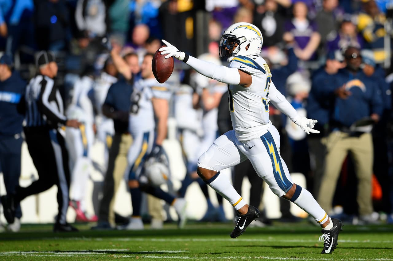 Los Angeles Chargers defensive back Adrian Phillips celebrates after intercepting a pass attempt in the first half of an NFL wild card playoff football game against the Baltimore Ravens, Sunday, Jan. 6, 2019, in Baltimore. (AP Photo/Nick Wass)