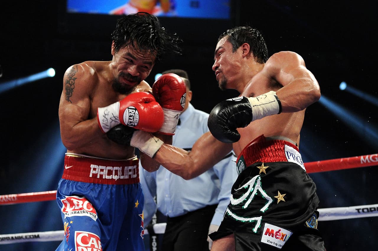 En 2008 se concretaba la esperada revancha con Pacquiao, rivalidad que años después se forjaría como uno de las más grandes del boxeo. Márquez perdía su título vía decisión dividida.