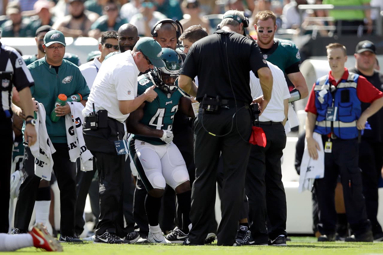 Philadelphia Eagles' Darren Sproles is helped up after an injury during the first half of an NFL football game against the New York Giants, Sunday, Sept. 24, 2017, in Philadelphia. (AP Photo/Matt Rourke)