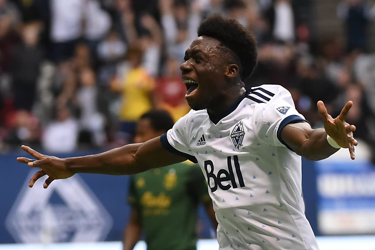 Oct 28, 2018; Vancouver, British Columbia, CAN; Vancouver Whitecaps midfielder Alphonso Davies (67) celebrates after scoring a goal against Portland Timbers goalkeeper Jeff Attinella (not pictured) during the first half at BC Place. Mandatory Credit: Anne-Marie Sorvin-USA TODAY Sports