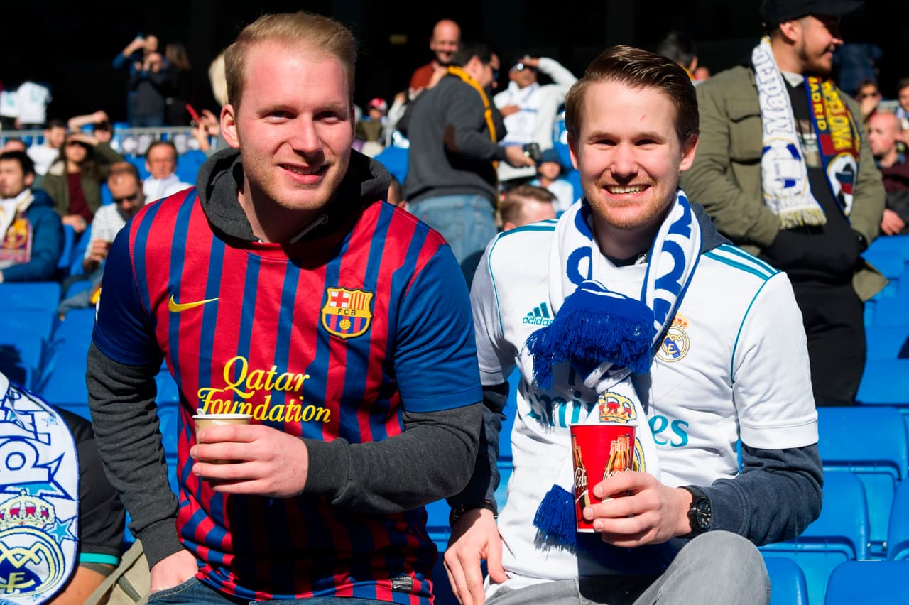 Supporters wait for the start of the Spanish League "Clasico" football match Real Madrid CF vs FC Barcelona at the Santiago Bernabeu stadium in Madrid on December 23, 2017. / AFP PHOTO / CURTO DE LA TORRE (Photo credit should read CURTO DE LA TORRE/AFP/Getty Images)