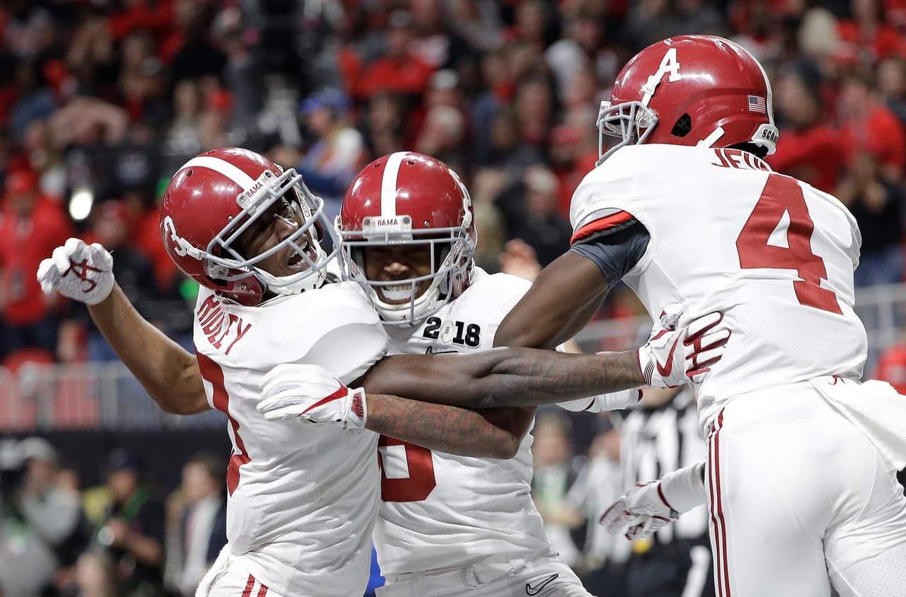 Alabama wide receiver DeVonta Smith (6) celebrates his touchdown during overtime of the NCAA college football playoff championship game against Georgia, Monday, Jan. 8, 2018, in Atlanta. Alabama won 26-23 in overtime.(AP Photo/David J. Phillip)