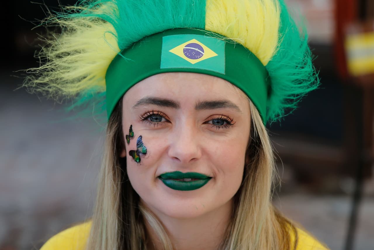 A Brazil's supporter poses in Moscow before the Russia 2018 World Cup quarter-final football match between Belgium and Brazil on July 6, 2018. (Photo by Maxim ZMEYEV / AFP) (Photo credit should read MAXIM ZMEYEV/AFP/Getty Images)