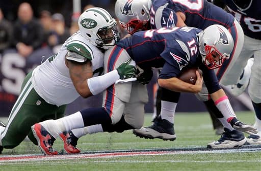 Tom Brady comandó a los Patriots a seguir inquebrantables en la NFL al derrotar a los Jets 30-23. Checa las mejores tomas de este encuentro de la Este AFC.