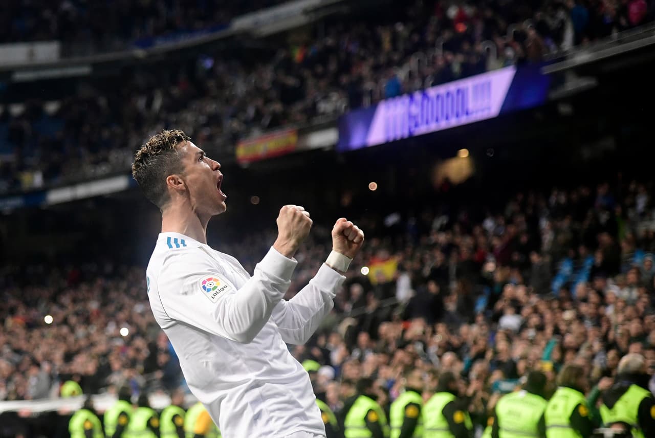 Real Madrid's Portuguese forward Cristiano Ronaldo celebrates a goal during the Spanish League football match between Real Madrid CF and Girona FC at the Santiago Bernabeu stadium in Madrid on March 18, 2018. / AFP PHOTO / JAVIER SORIANO (Photo credit should read JAVIER SORIANO/AFP/Getty Images)
