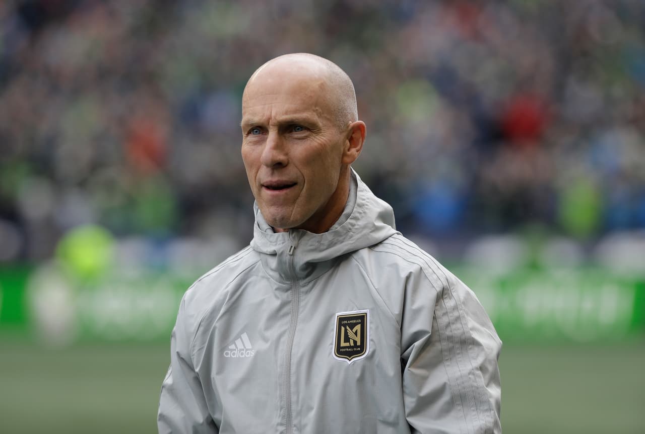 In this March 4, 2018 photo Los Angeles head coach Bob Bradley walks on the pitch before an MLS soccer match against the Seattle Sounders in Seattle. Probably the most prominent of the “new” coaches this season is MLS vet Bob Bradley, who has the expansion Los Angeles FC in the playoff picture with seven games remaining. (AP Photo/Ted S. Warren)