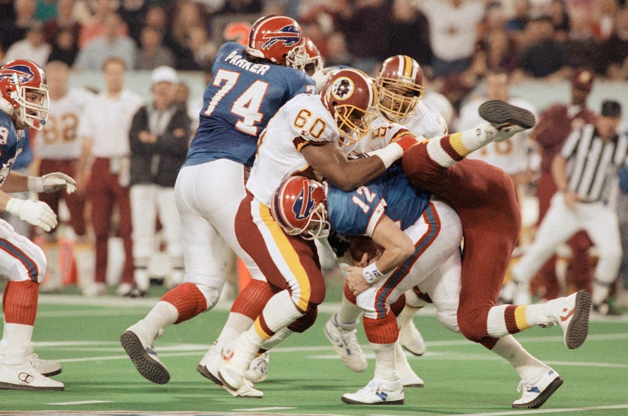 Super Bowl XXVI (Washington Redskins 37-24 Buffalo Bills) | El SB regresó al norte, en el Metrodome de Minnesota. MVP: Mark Rypien (QB Washington). Comercial de 30 segundos: 850 mil dólares por la CBS.