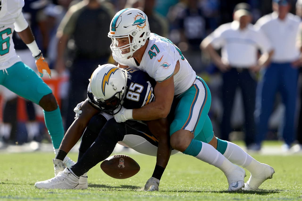 SAN DIEGO, CA - NOVEMBER 13: Antonio Gates #85 of the San Diego Chargers drops a pass as Kiko Alonso #47 of the Miami Dolphins defends during the first half of a game at Qualcomm Stadium on November 13, 2016 in San Diego, California. (Photo by Sean M. Haffey/Getty Images)